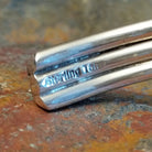 Close-up of the artisan's stamped signature.