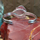 Sterling silver cuff bracelet with lapis set in a triad of bezels, framed by twisted rope accents.