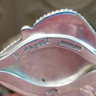 Close-up of the artisan's stamped signature.