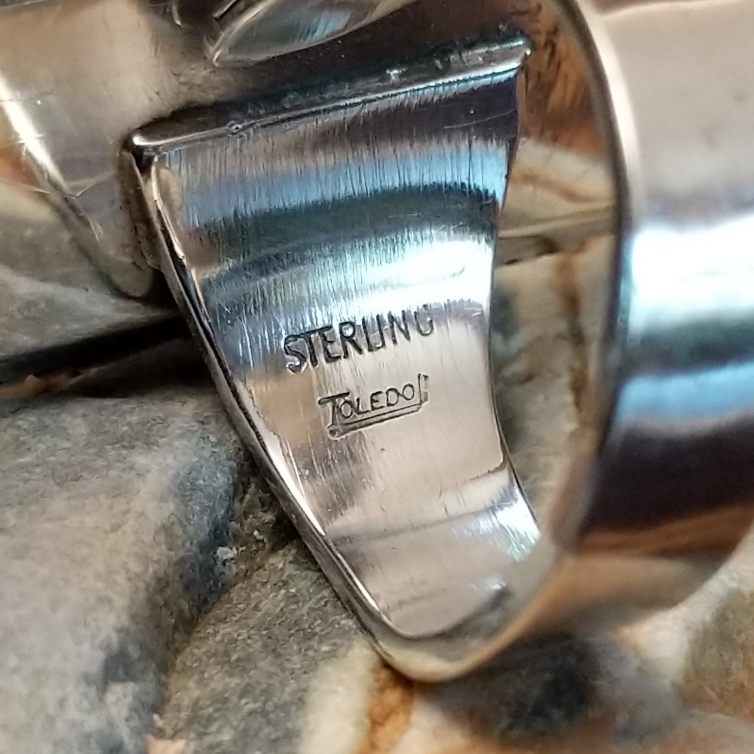 Handcrafted sterling silver ring by Toledo featuring three oval lapis stones in a vertical arrangement with geometric silver accents in a traditional Southwestern Native American design.  Artisan and Sterling Silver stamp.