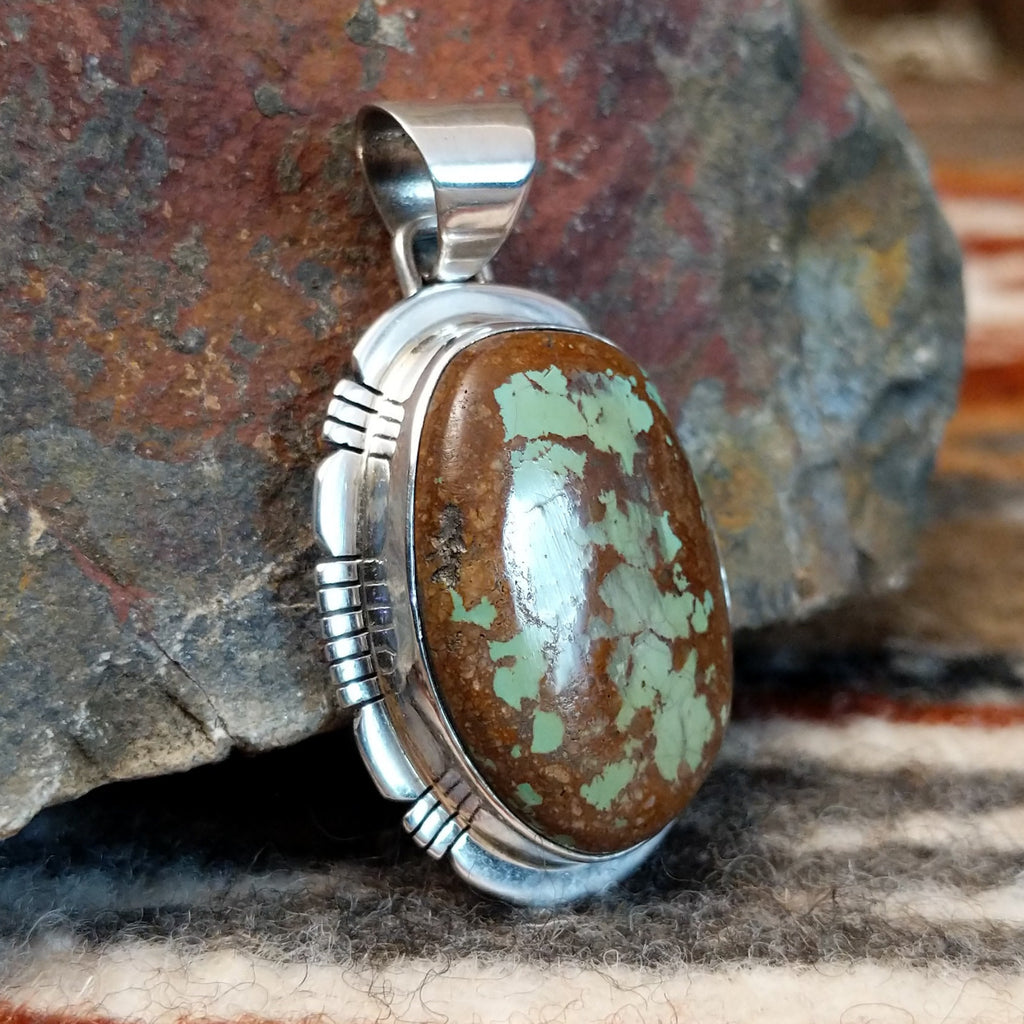 Large pendant with sterling silver setting and boulder turquoise.