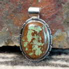 Large pendant with sterling silver setting and boulder turquoise.