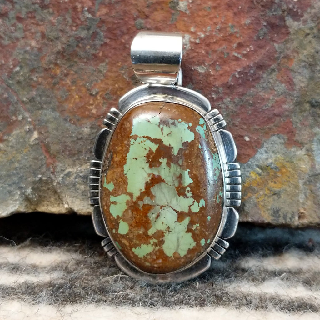 Large pendant with sterling silver setting and boulder turquoise.