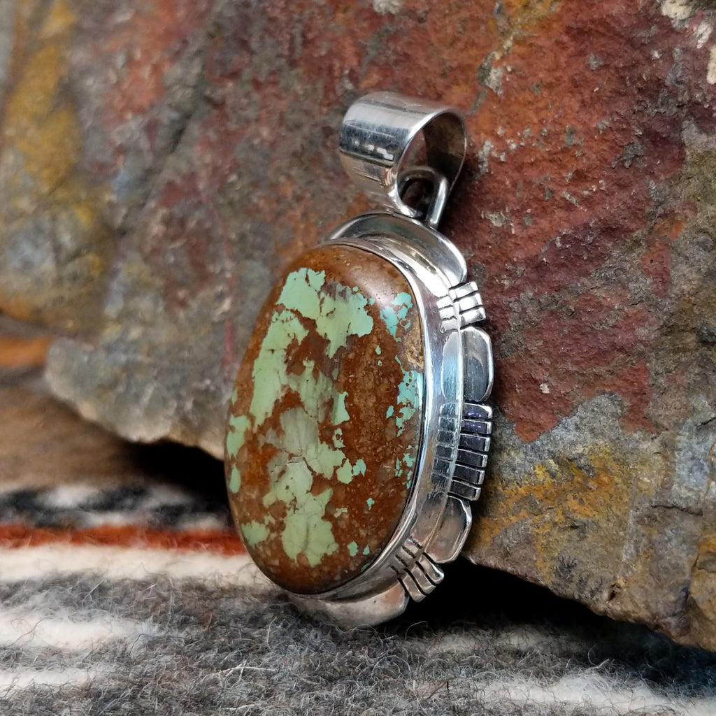Large pendant with sterling silver setting and boulder turquoise.