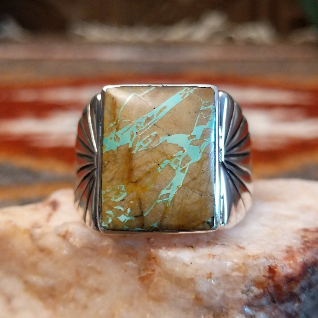 Boulder turquoise set in the square sterling silver bezel of the ring.