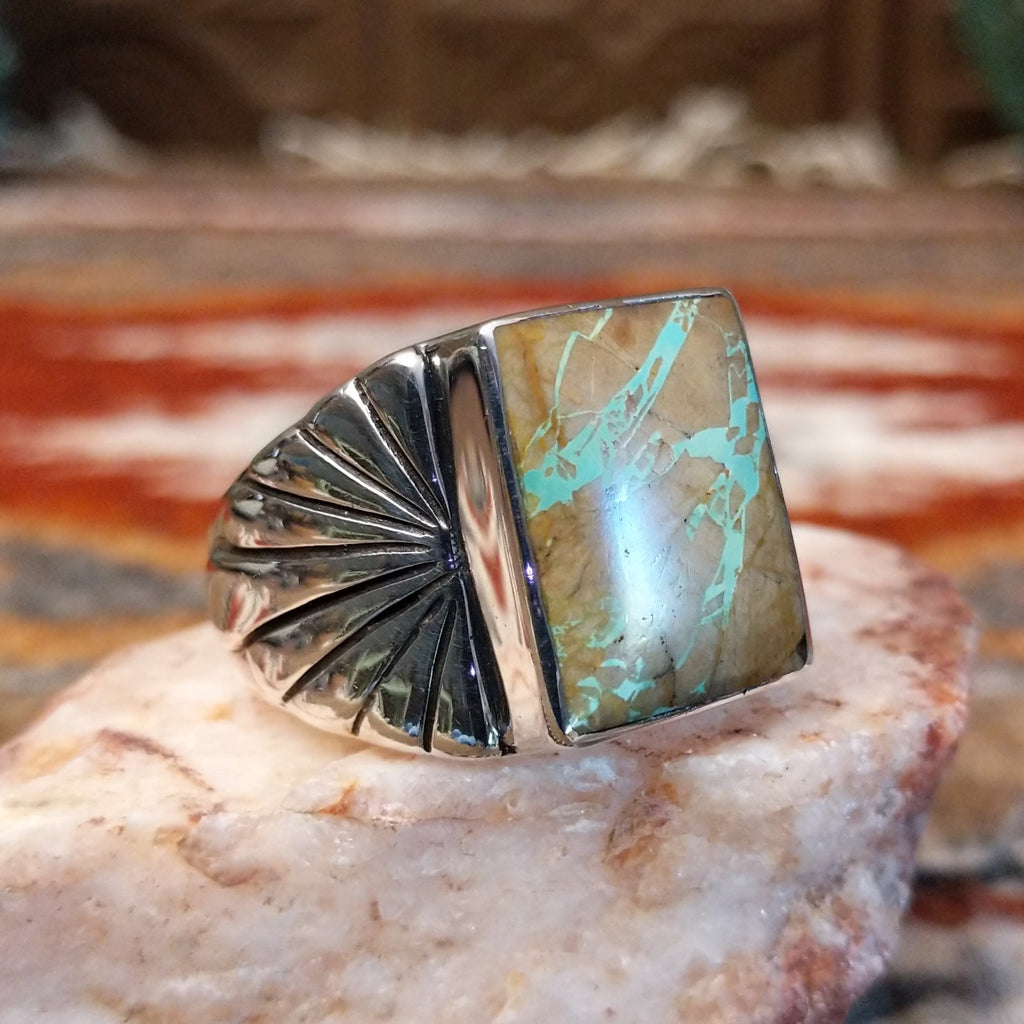 Boulder turquoise set in the square sterling silver bezel of the ring.
