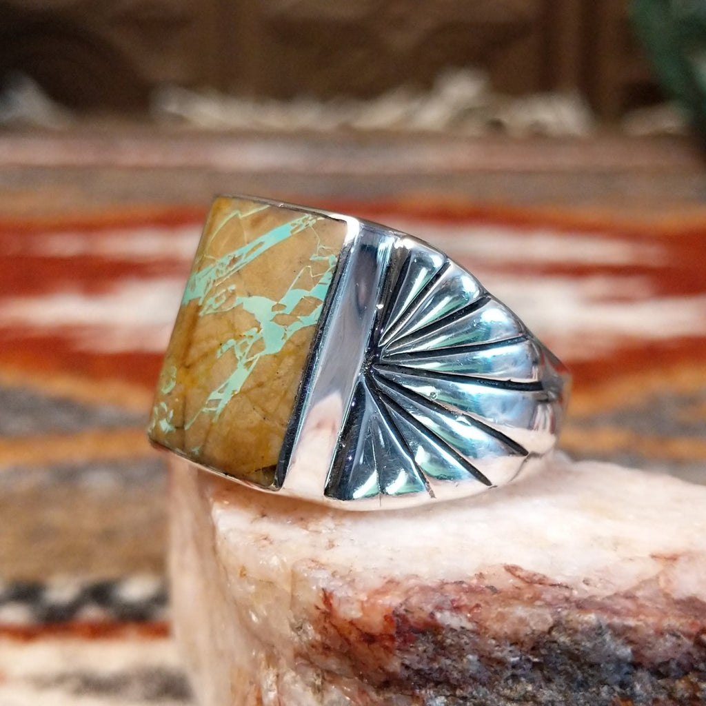 Boulder turquoise set in the square sterling silver bezel of the ring.