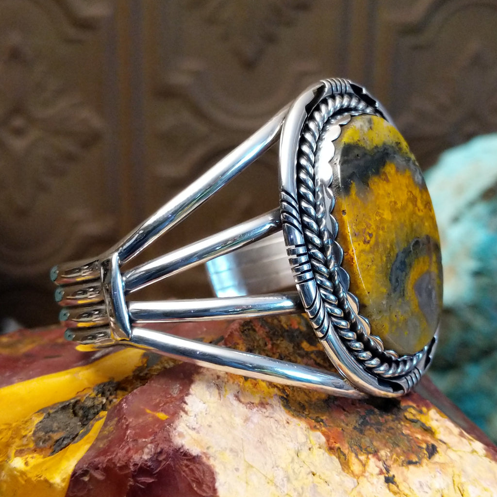 Large bumblebee jasper framed by twisted rope accent and layered band of the cuff.