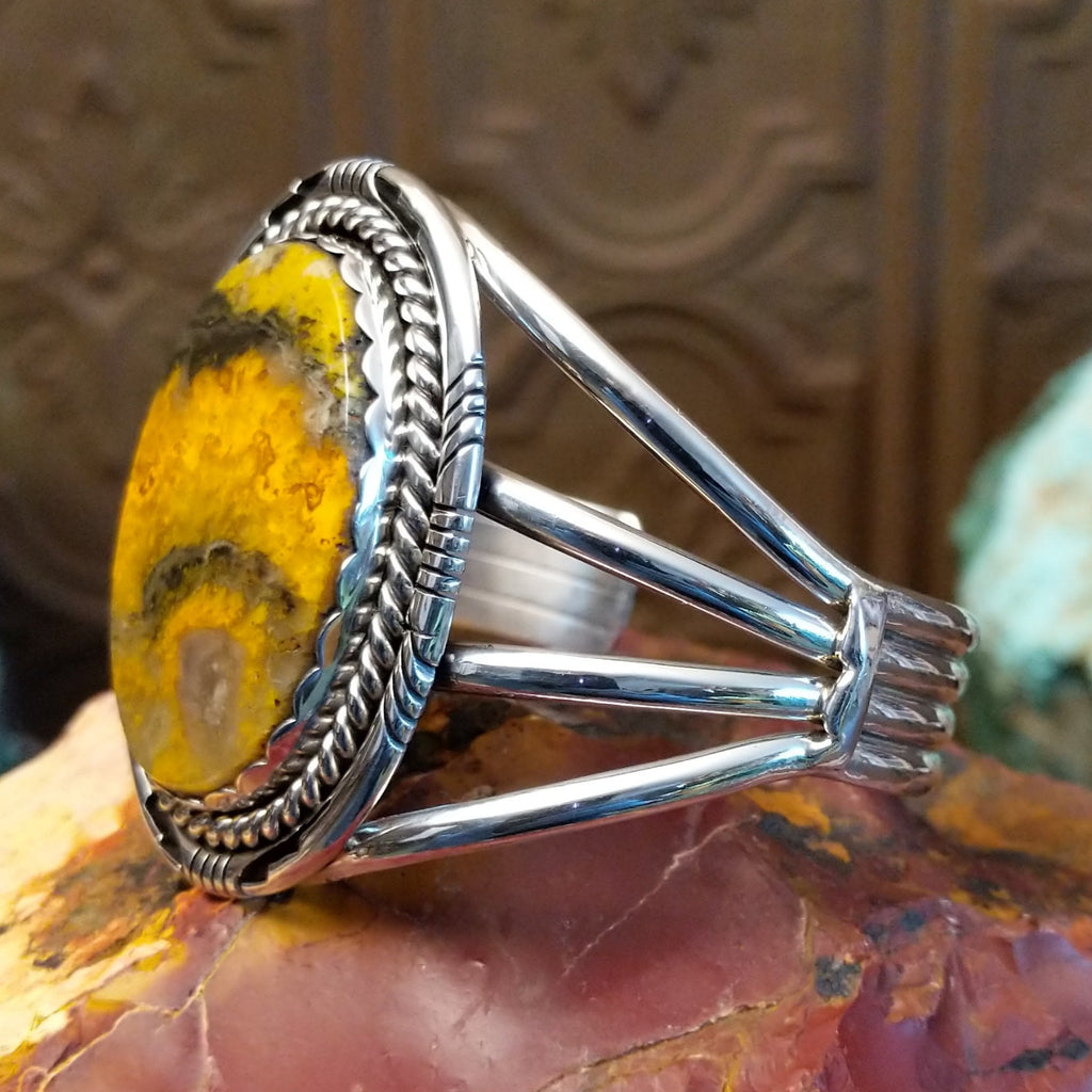 Large bumblebee jasper framed by twisted rope accent and layered band of the cuff.