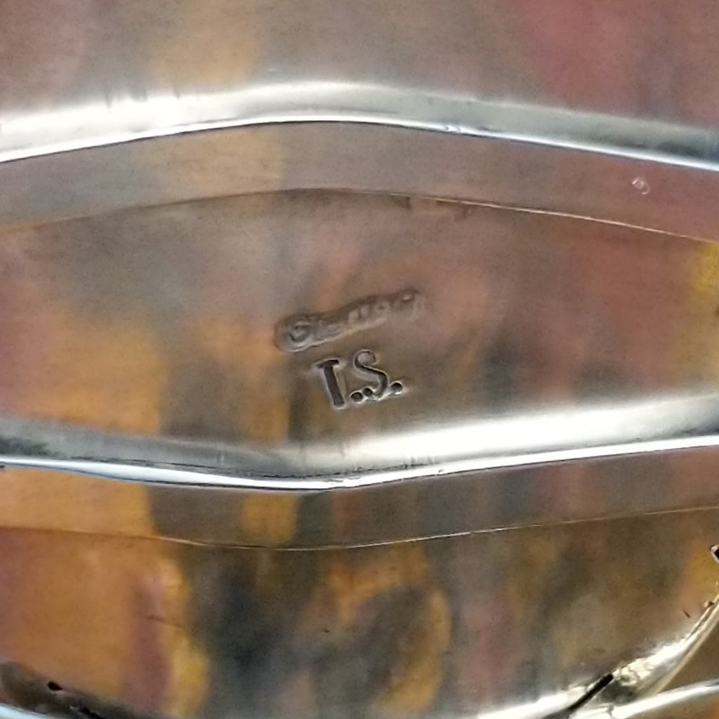 The artisan's stamped signature.