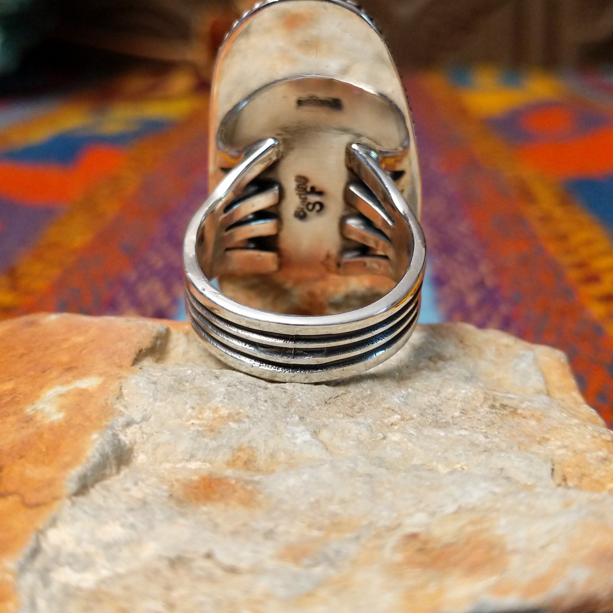 Large Charoite Ring by Sharon Francisco featuring an elongated purple charoite stone with natural swirling patterns, framed by twisted rope detailing and set in Sterling Silver; underside view.
