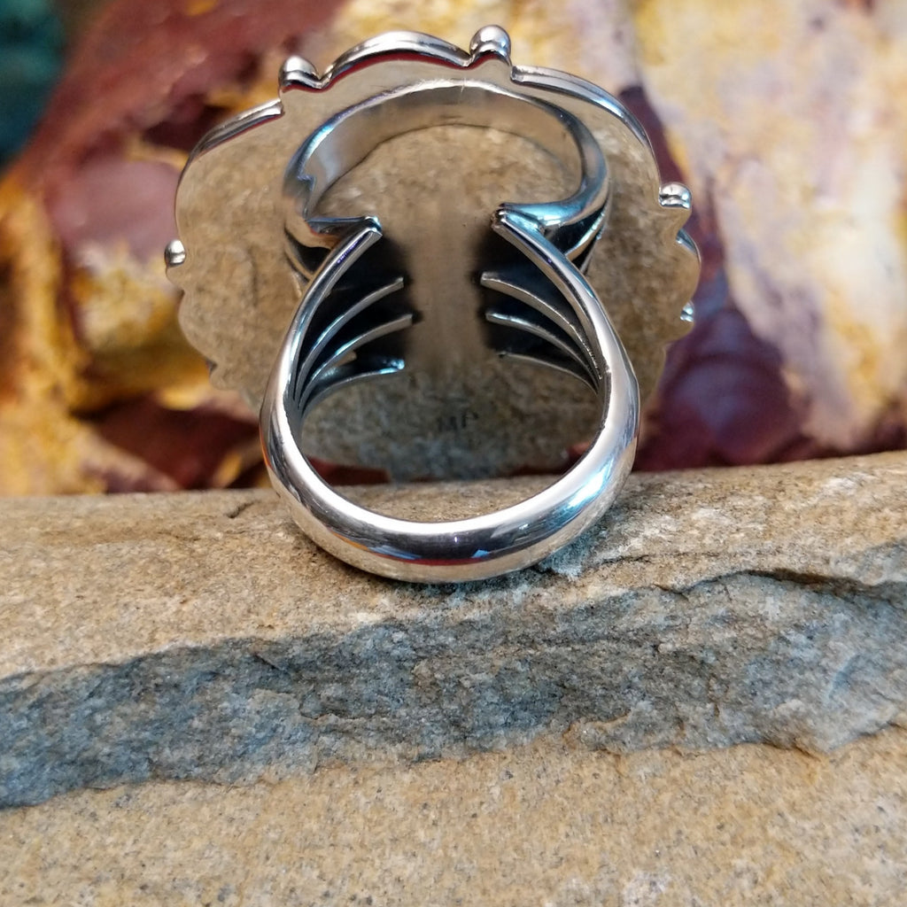 The band of the ring is polished sterling silver.