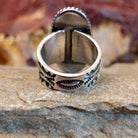 Intricate stamped designs on the silver band.