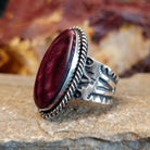 Purple spiny oyster shell set in a twisted rope bezel.