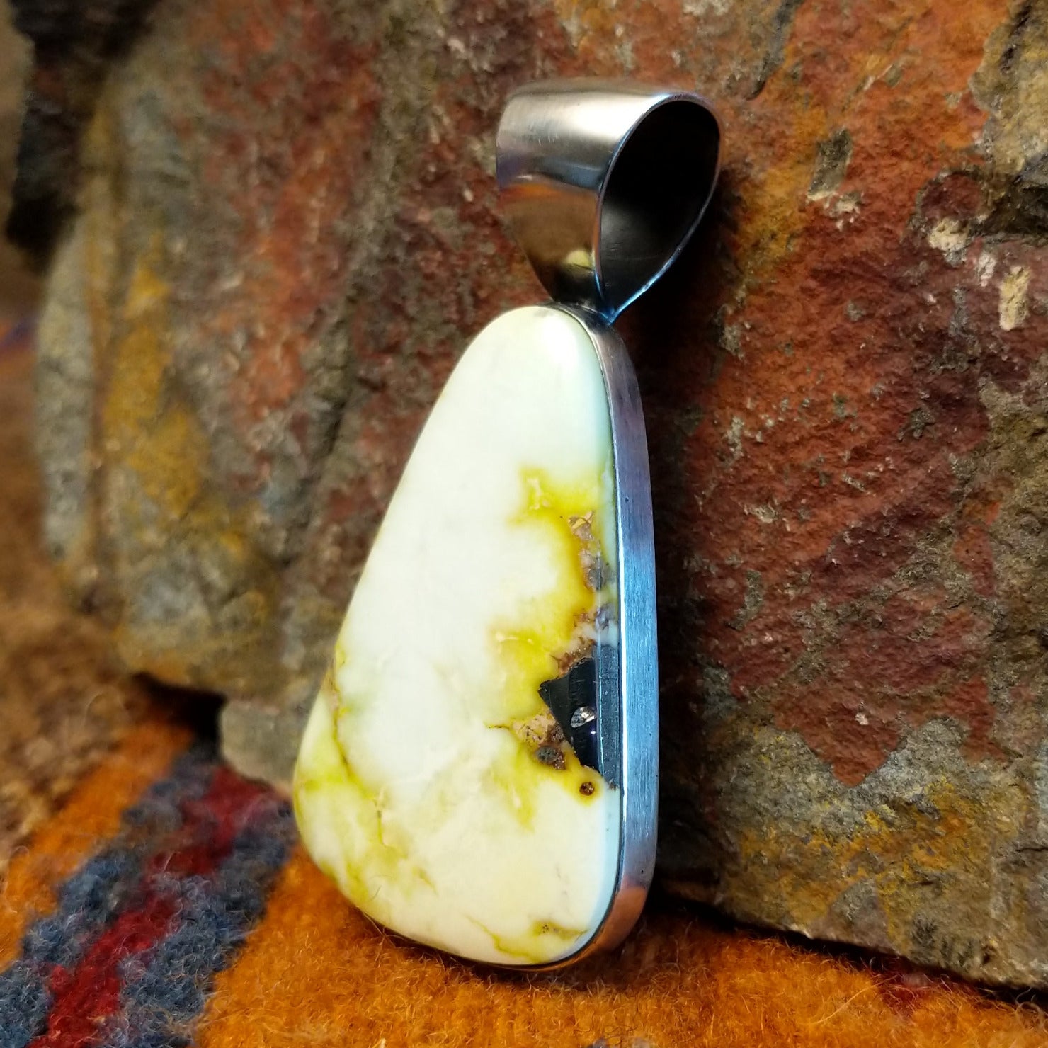 Sterling silver pendant with palomino variscite set in the bezel.