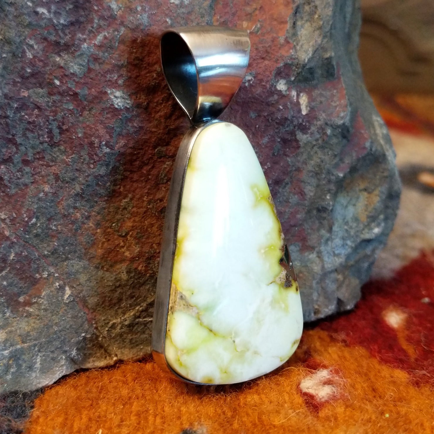 Sterling silver pendant with palomino variscite set in the bezel.