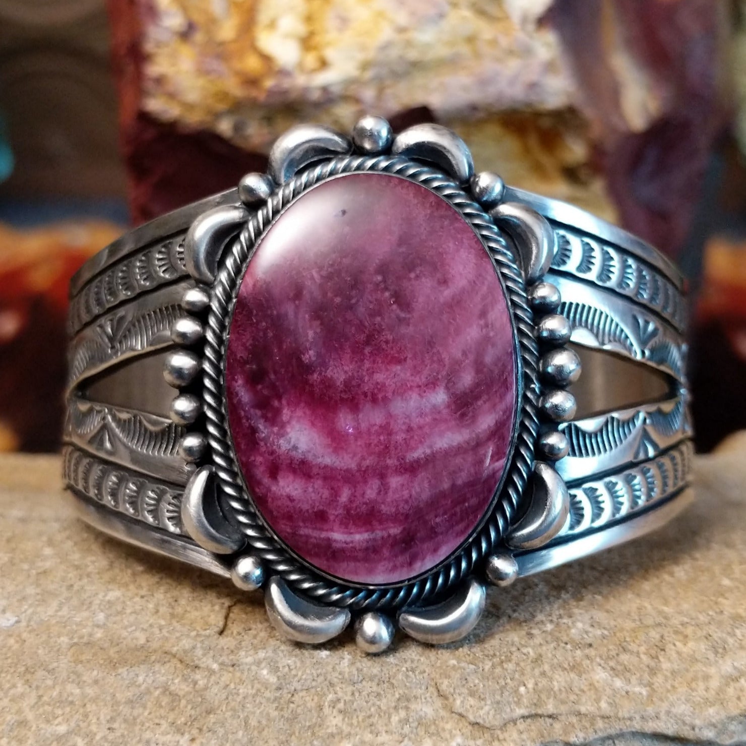 Large purple spiny oyster shell cuff set in detailed sterling silver.