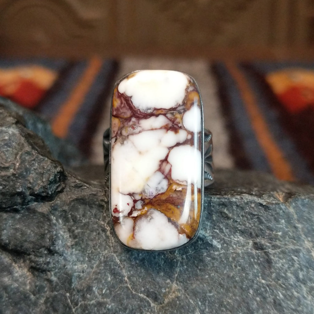 Wild horse stone with brown matrix set in a polished bezel.