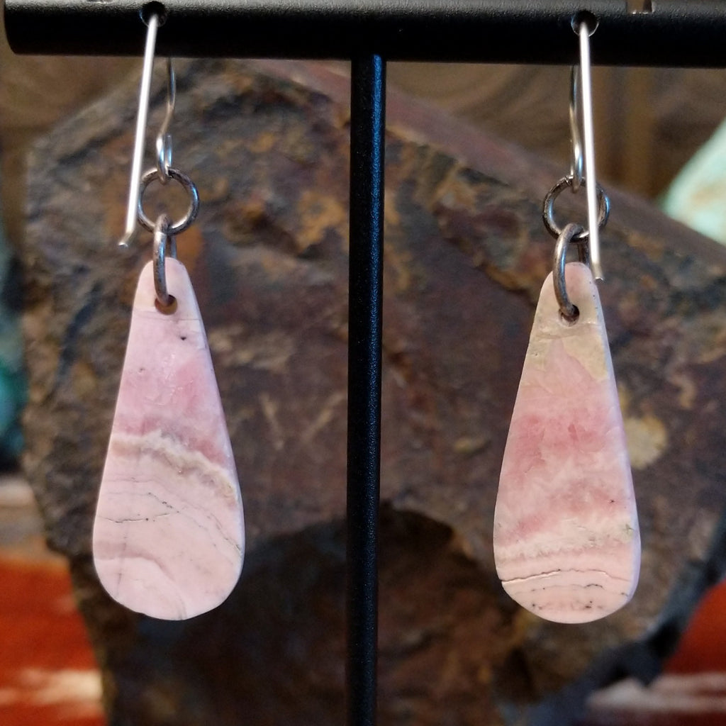 Teardrop shaped rhodochrosite earrings with dangle hooks.
