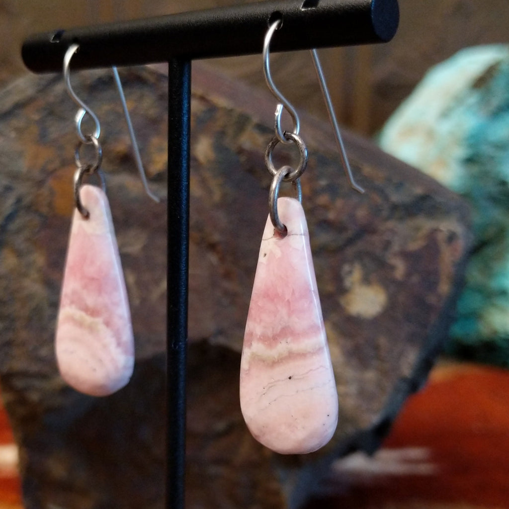 Teardrop shaped rhodochrosite earrings with dangle hooks.