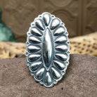 Large stamped sterling silver ring by Charles Johnson, featuring intricate hand-stamped patterns on a bold polished silver band with traditional Southwestern-inspired craftsmanship.