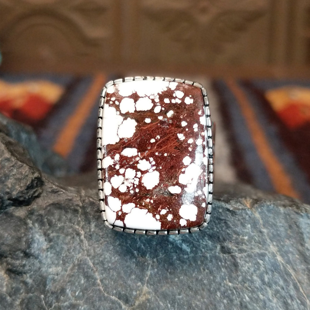 Large wild horse stone set in serrated bezel.