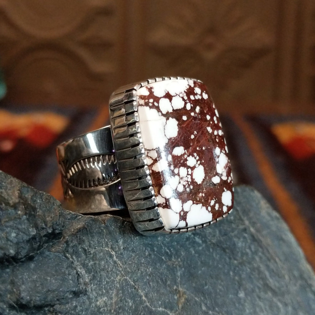 Large wild horse stone set in serrated bezel with intricately stamped band.