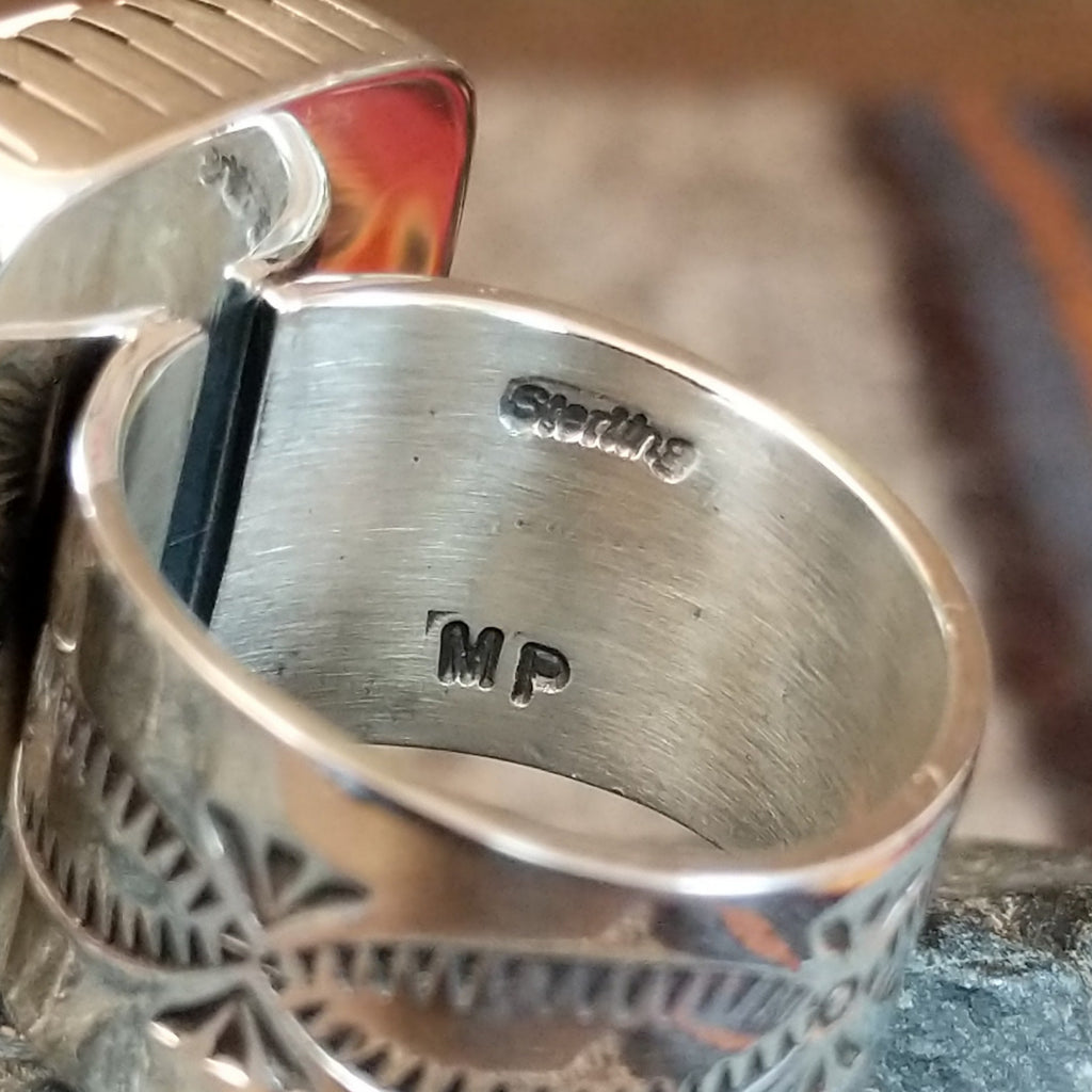 The authentication and signature of the artist is found on the interior of the ring.