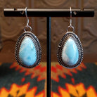 Sterling silver earrings with larimar set in geometric bezels, framed by twisted rope and stamped accents.