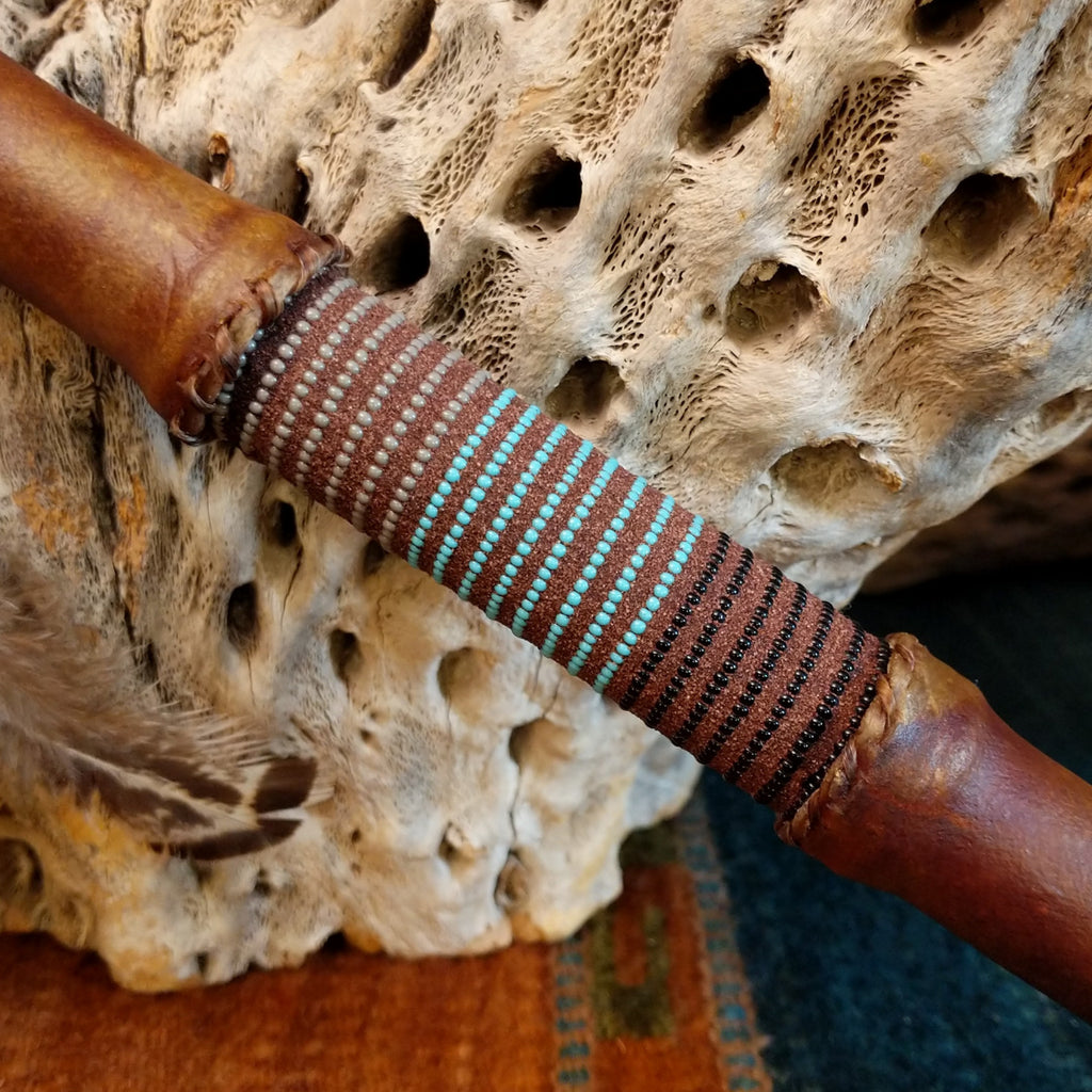 Close-up of the small, multicolored beads along the shaft.