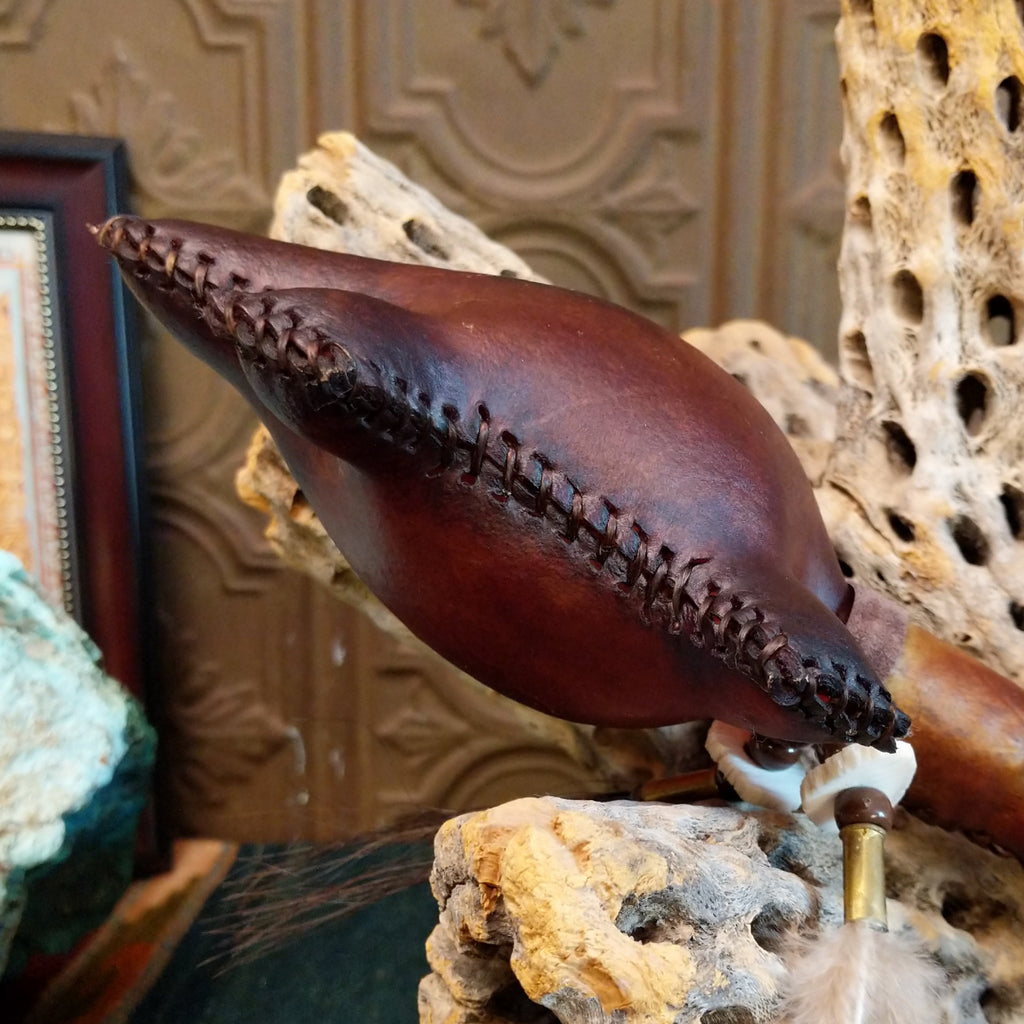 Close-up of the stitching on the leather rattle.