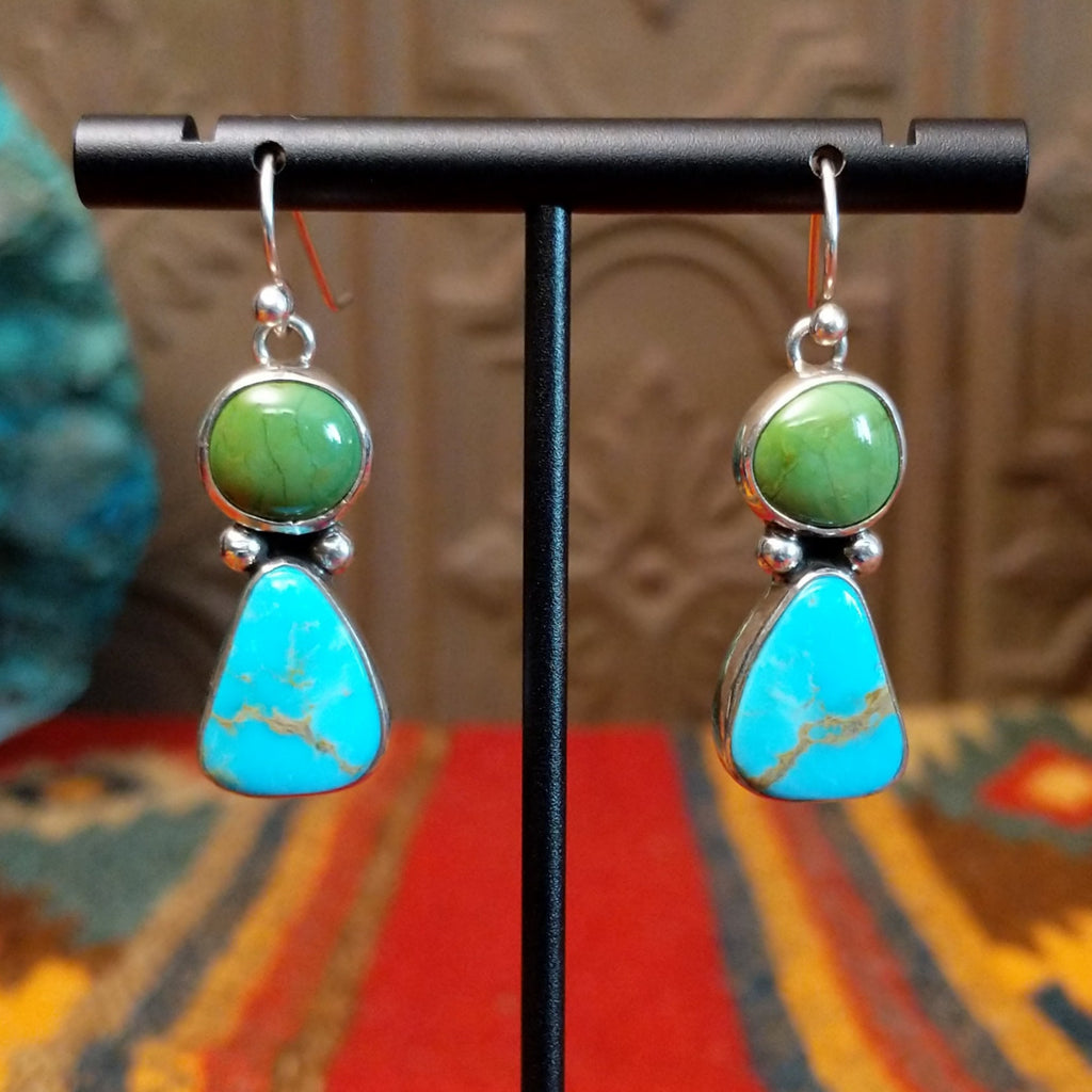 Dangle earrings with green and blue turquoise stones and dot work.