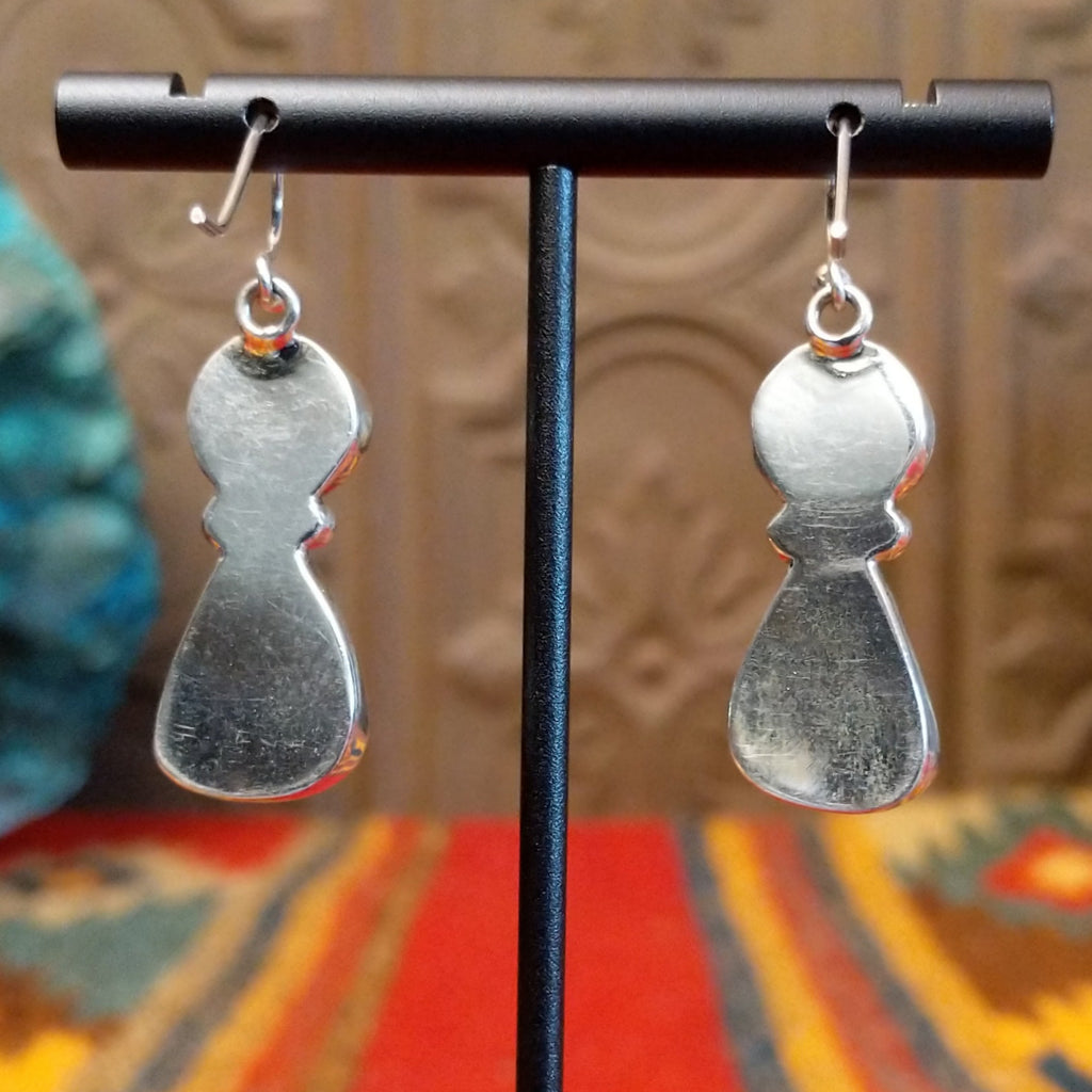 The earrings are smooth silver of the settings.