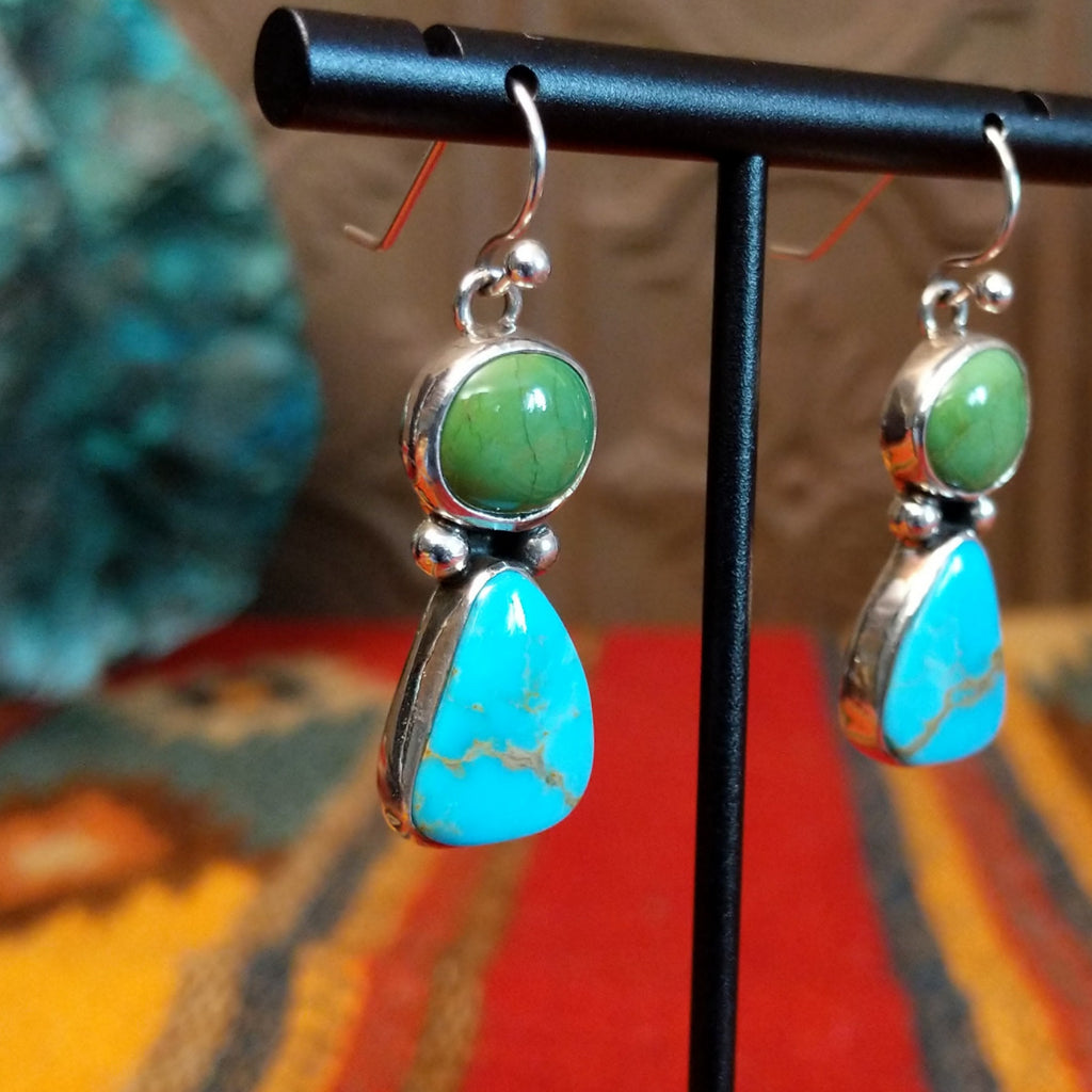 Dangle earrings with green and blue turquoise stones and dot work.