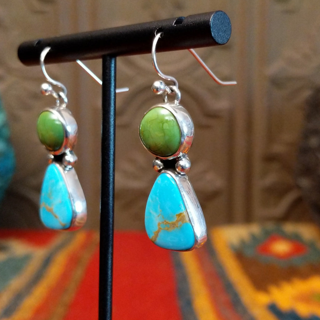 Dangle earrings with green and blue turquoise stones and dot work.