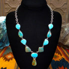 Turquoise necklace linked on a sterling silver chain with alternating green and blue turquoise stones.