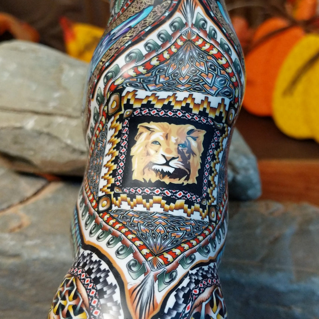 A detailed view of the painted lion head on the back.