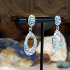 Austrian crystal loop earrings with multicolored crystals and sterling silver.