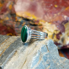 Sterling silver ring with malachite set within the bezel and layered band.