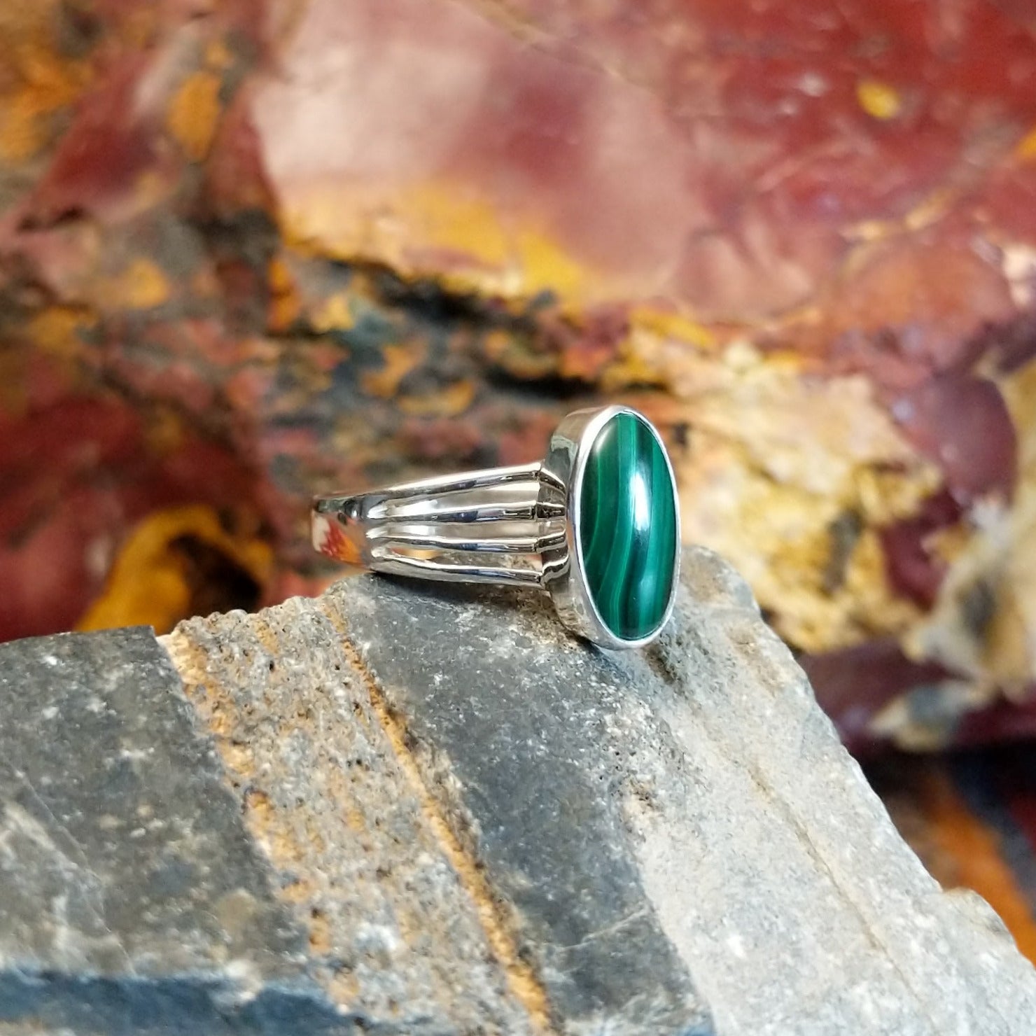 Sterling silver ring with malachite set within the bezel and layered band.