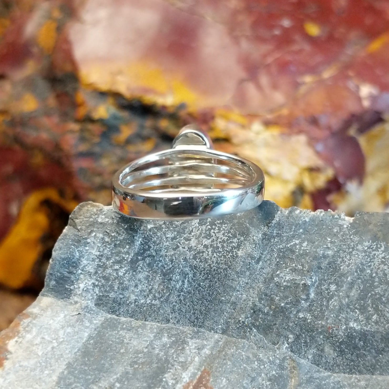 Sterling silver ring with malachite set within the bezel and layered band.