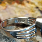Close-up of the artisan's stamped signature.