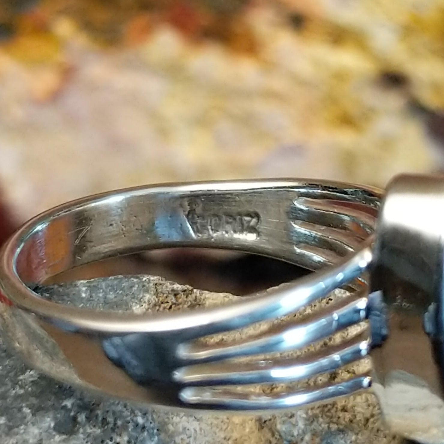 Close-up of the artisan's stamped signature.