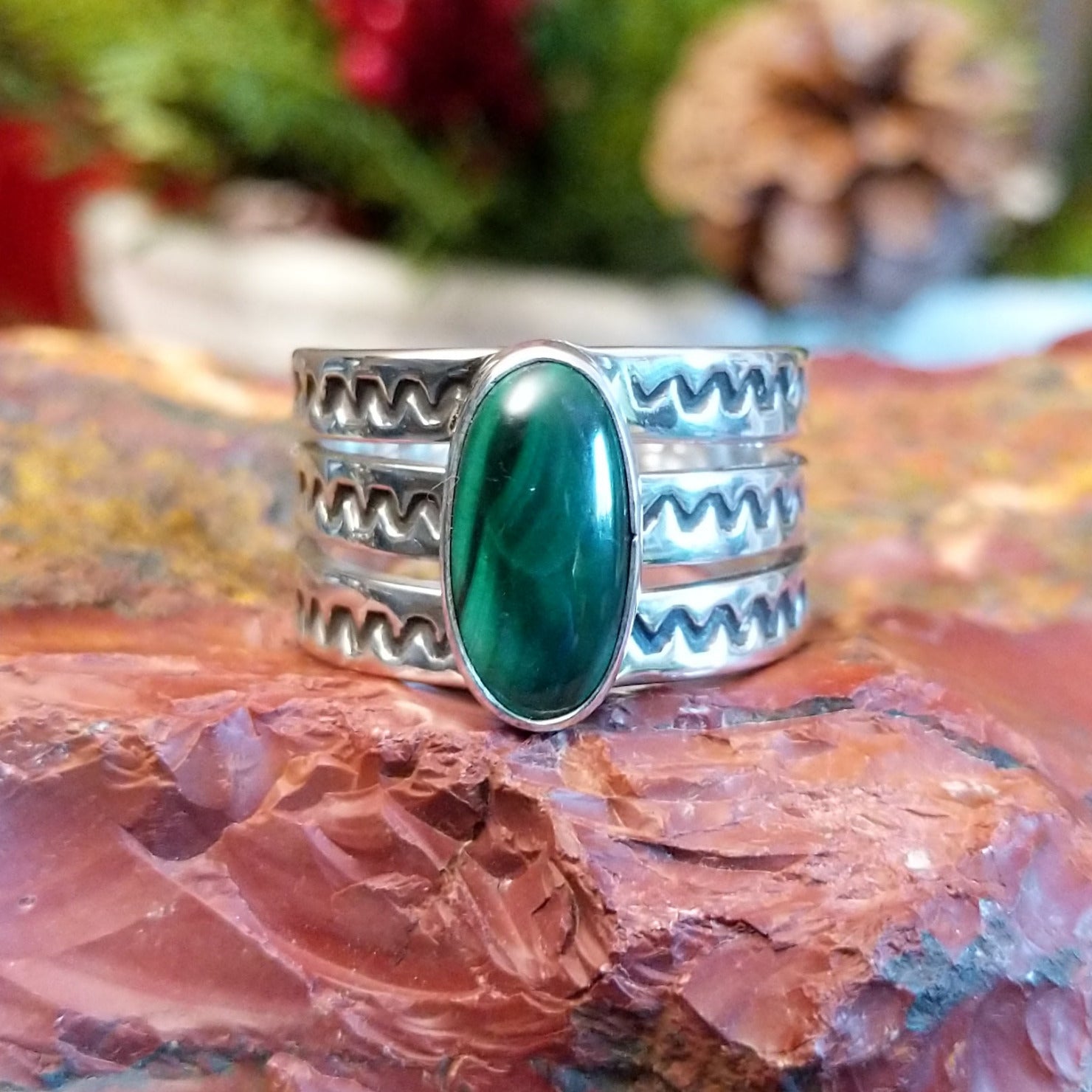 Sterling silver ring with tri-band and malachite centerpiece.