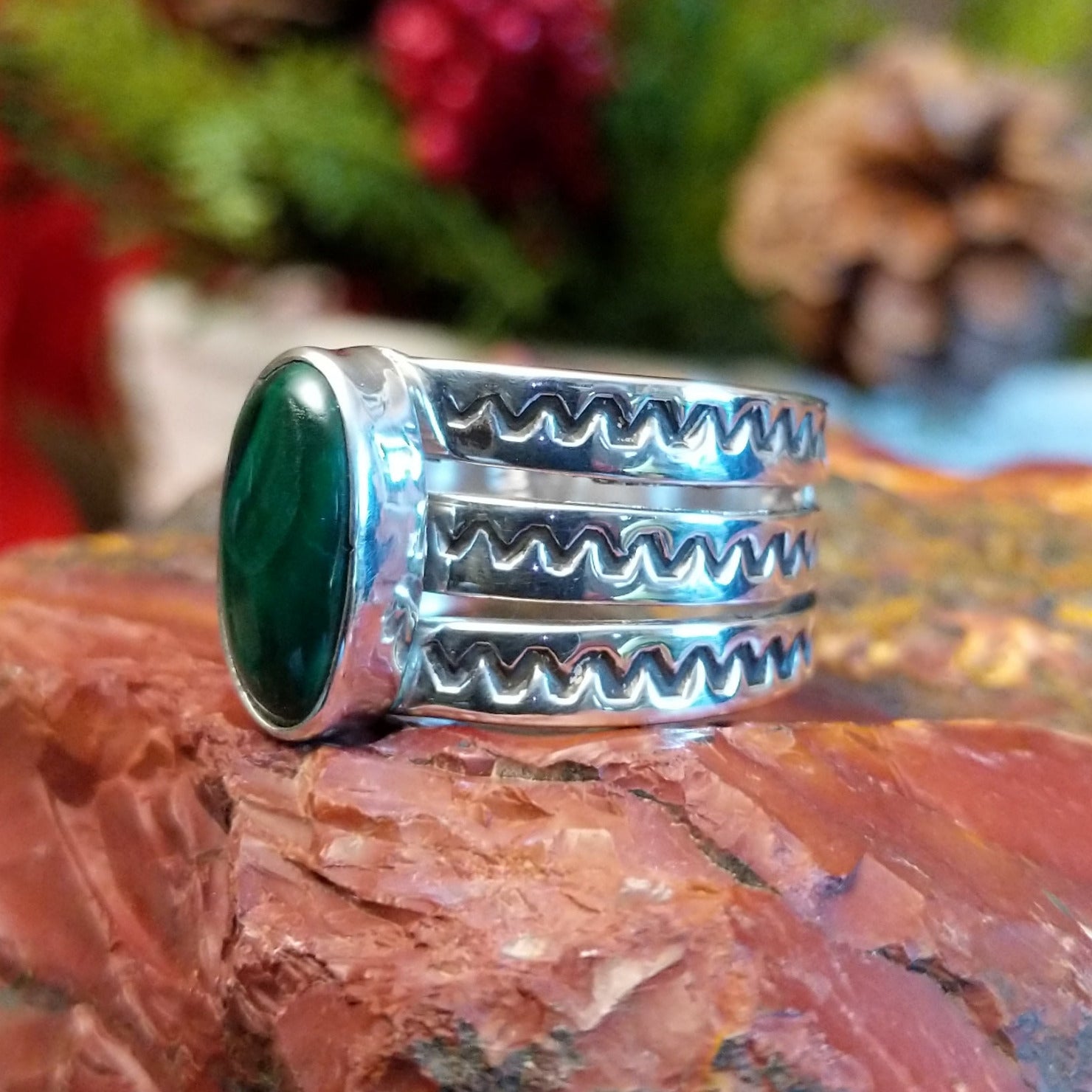 Sterling silver ring with tri-band and malachite centerpiece.