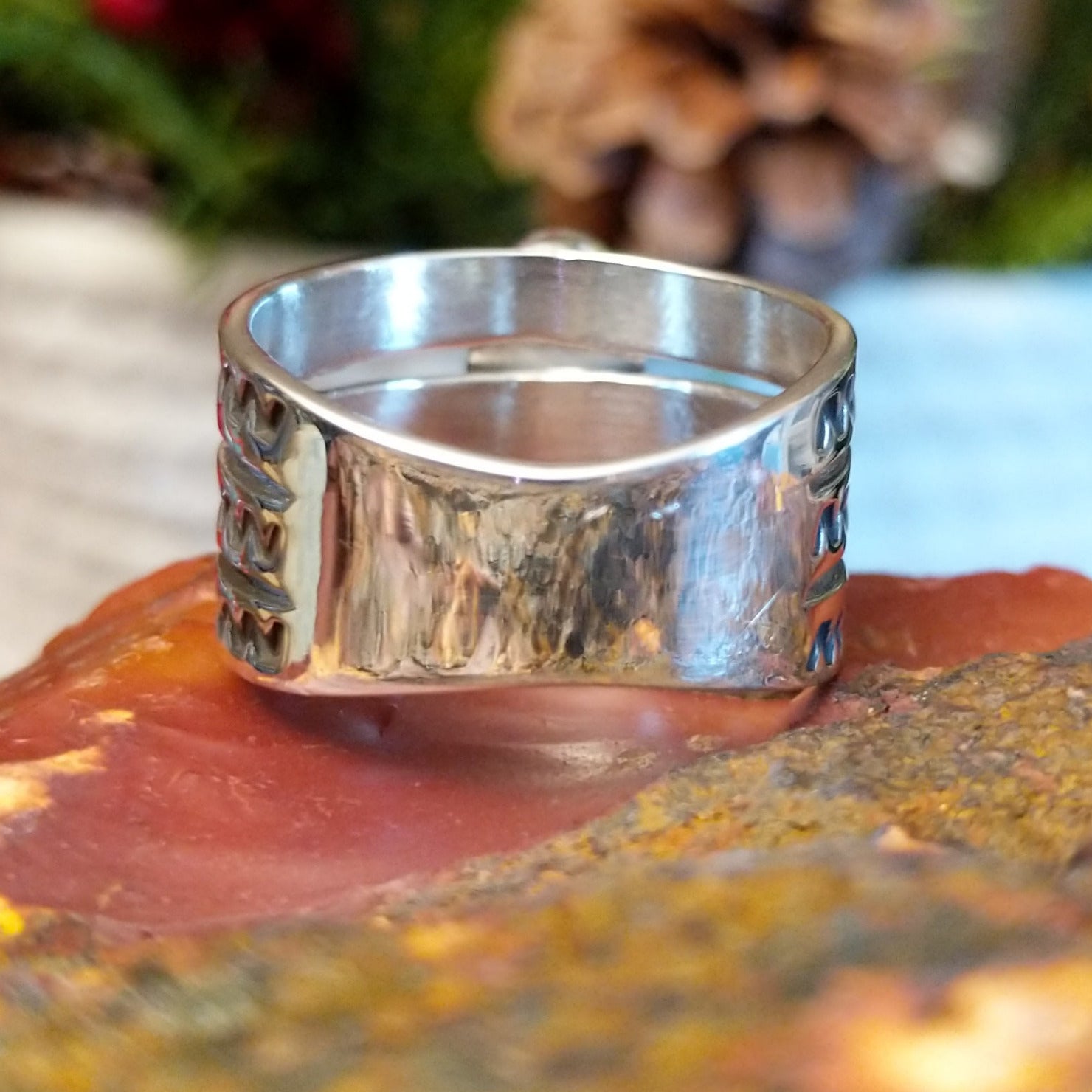 Sterling silver ring with tri-band and malachite centerpiece.