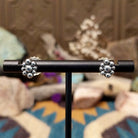 Handcrafted sterling silver adjustable earrings by Terry Wood featuring oval manmade opal cabochons with colorful iridescence and traditional Navajo silver bead cluster accents; viewed as stud only.