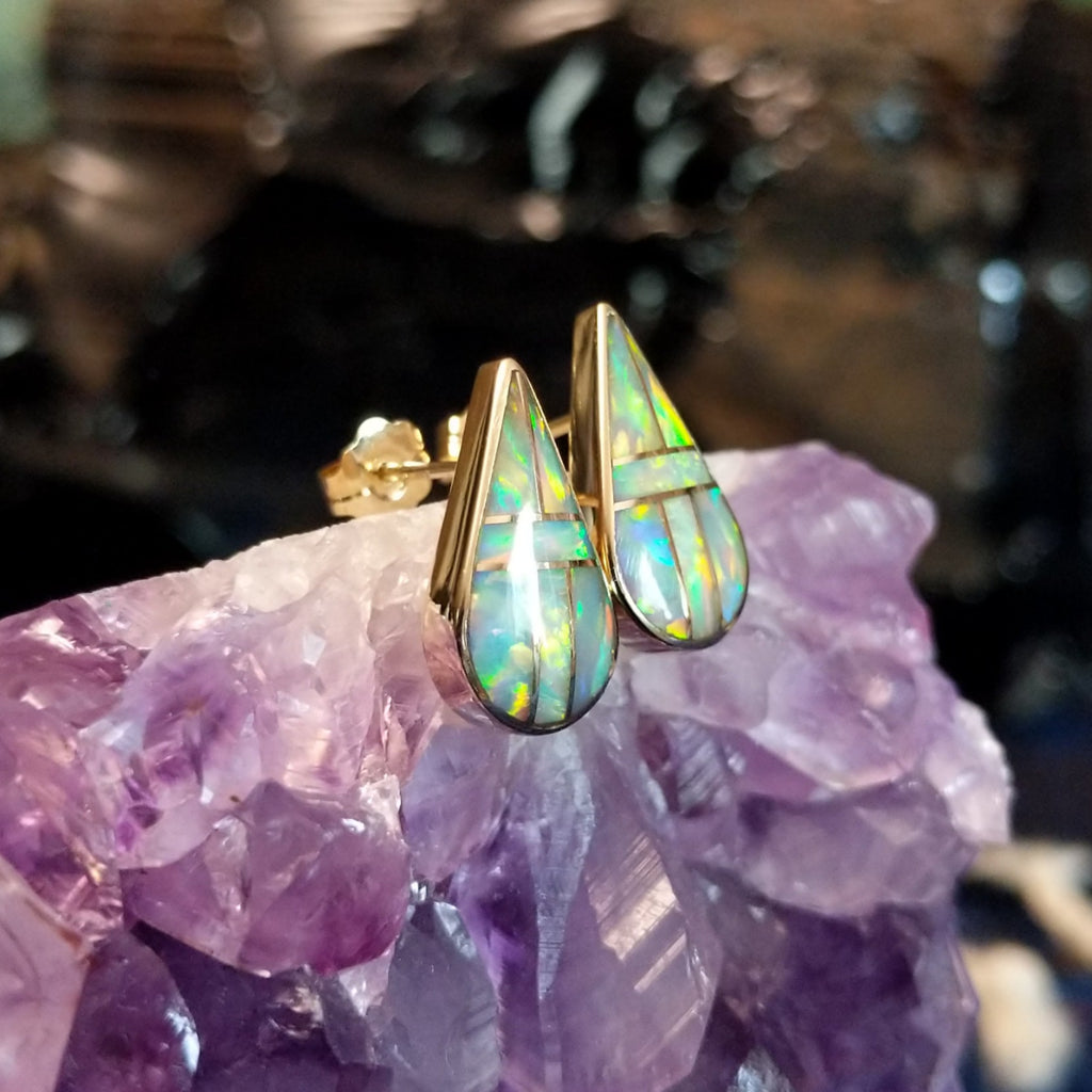 Teardrop earrings with manmade opal inlay and gold borders.