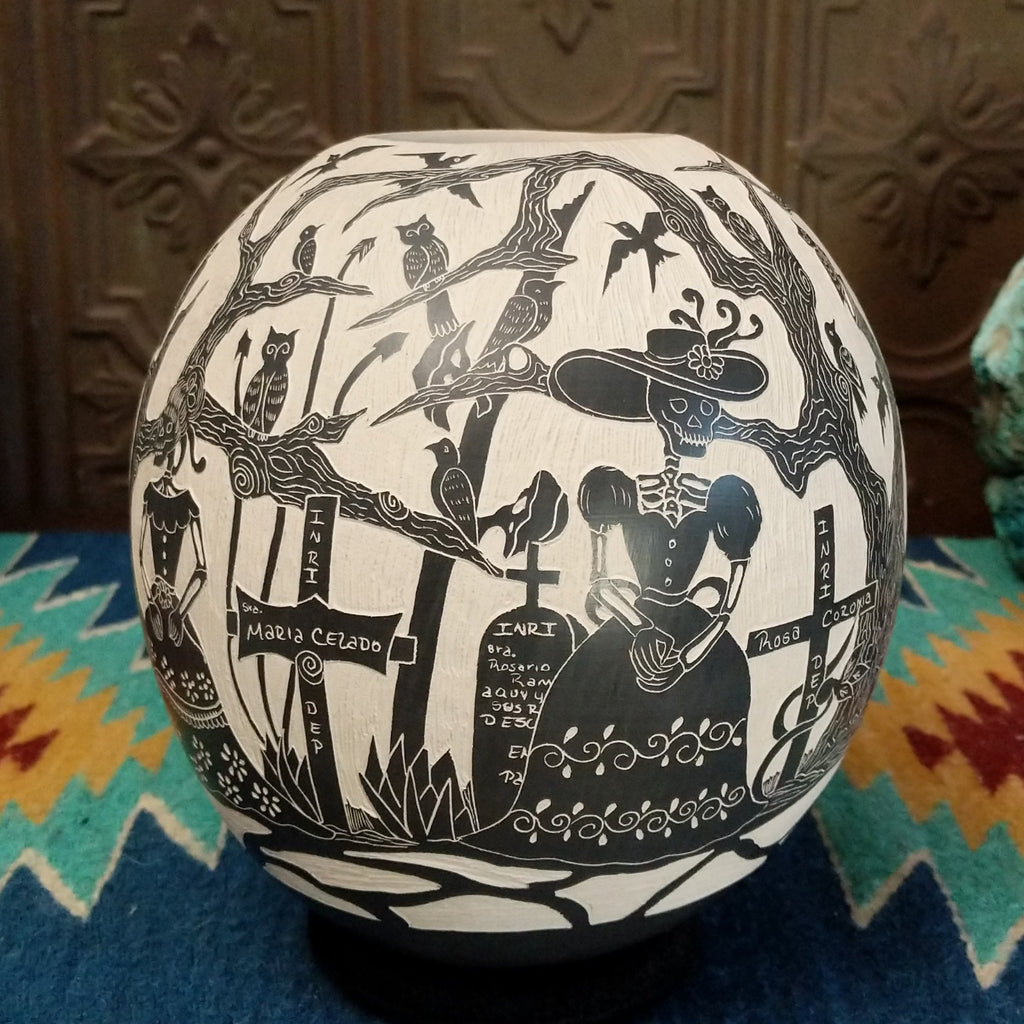 Etched Day of the Dead pottery piece in the colors black and white.