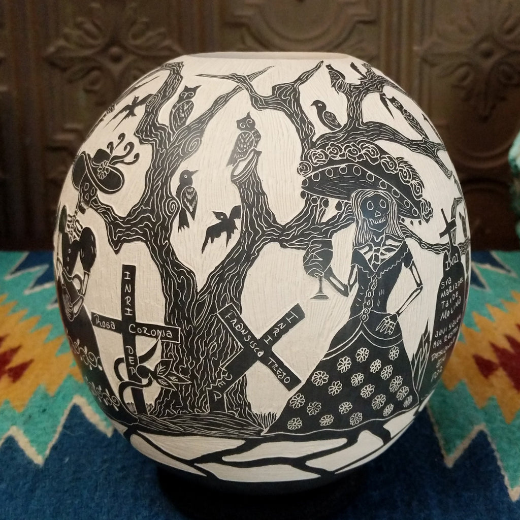 Etched Day of the Dead pottery piece in the colors black and white.